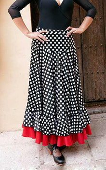 Falda flamenco negra con canesú y lunares blancos con volantes en el bajo