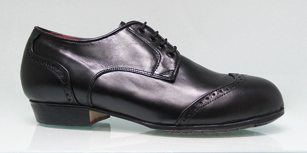 Chaussure de flamenco professionnelle noire à talon bas et ornement sur la tige