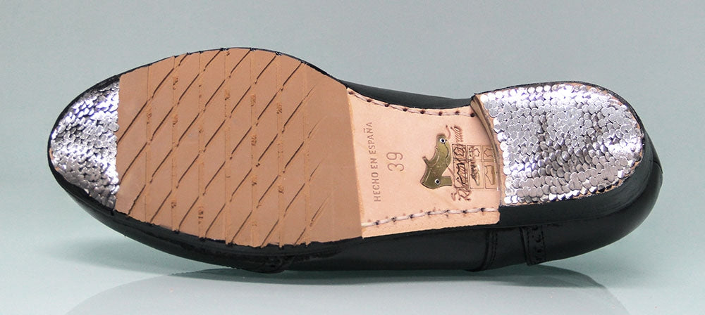 Chaussure de flamenco professionnelle noire à talon bas et ornement sur la tige