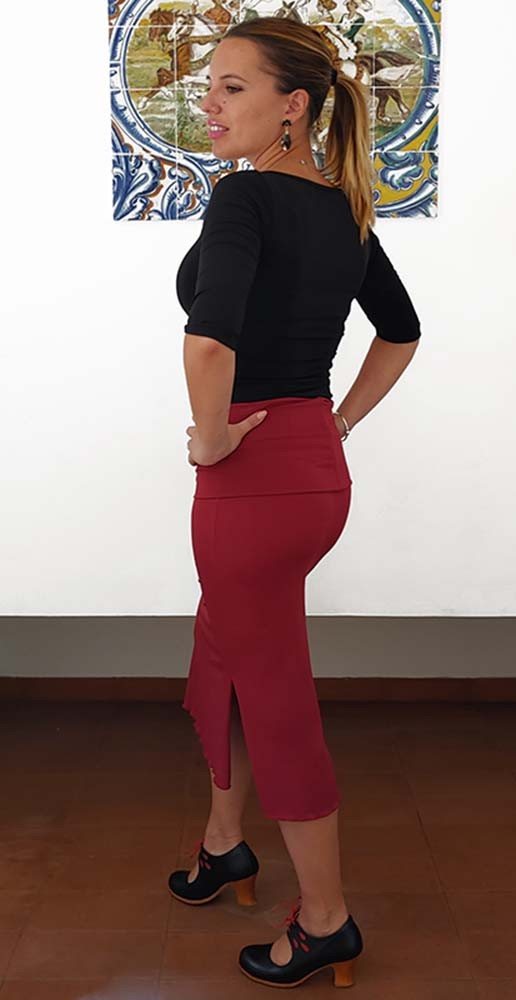 Short maroon skirt with sash.