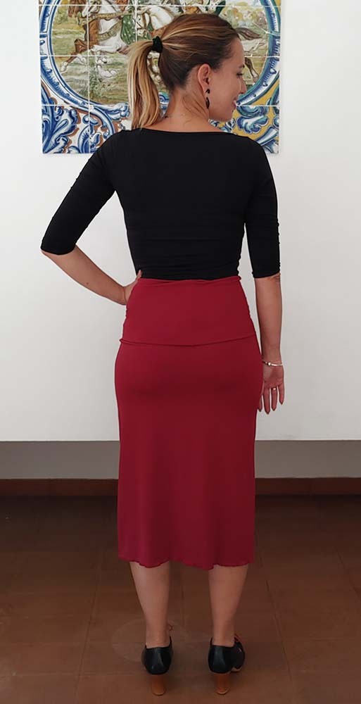 Short maroon skirt with sash.