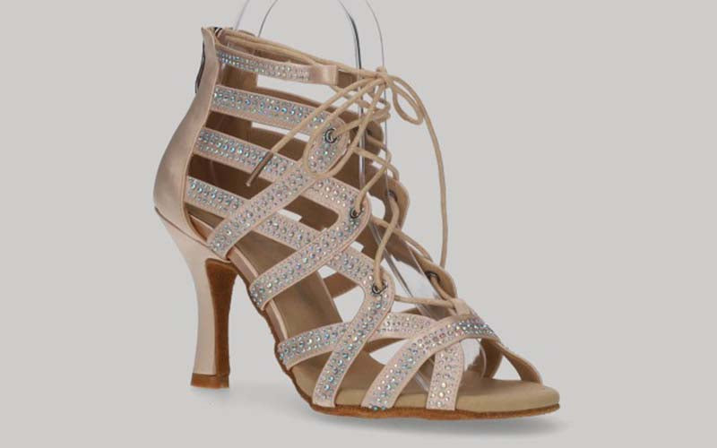 Pink ballroom ankle boot with crystal rhinestone cross-over straps, laces, and zipper closure at the heel