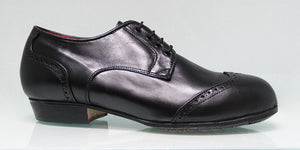 Chaussure de flamenco professionnelle noire à talon bas et ornement sur la tige