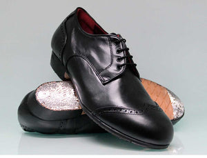 Chaussure de flamenco professionnelle noire à talon bas et ornement sur la tige