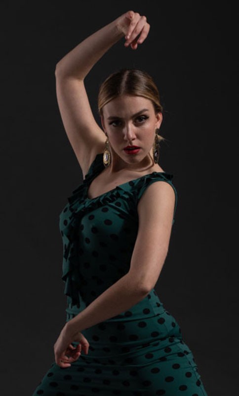 Green printed short strap top with neckline and ruffles.