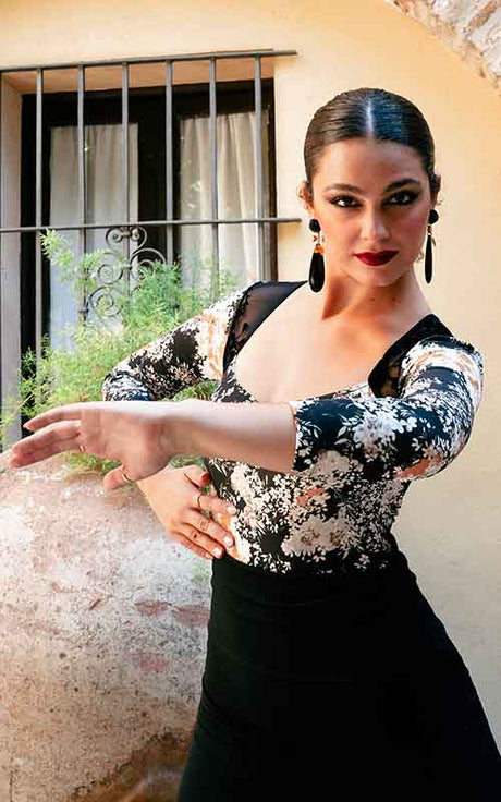 Printed bodysuit with long sleeves and black lace back