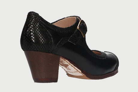 Professional flamenco dance shoe combining black leather and fantasy with a Cuban heel