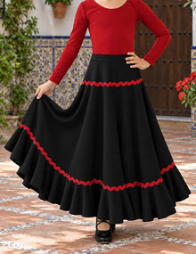 Falda flamenco de niña negra con adorno rojo y mucho vuelo