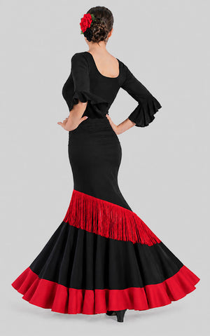 Falda flamenco negra con volante diagonal de flecos rojo y volante rojo en el bajo