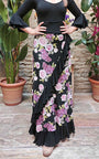 Falda flamenco estampada de flores en tonos pastel con volante diagonal e inferior negro