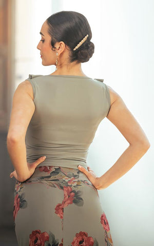 Short strappy top with neckline and ruffles in various colors.