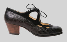 Professional flamenco dance shoe combining embossed black leather and black suede trim